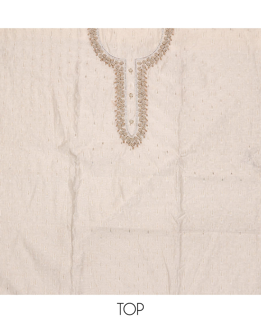 Cream Material Chudidar Set, Subtly Adorned with Sparese Buttas and Embroidery on Tissue Top, a Contrast Santoon Bottom, and Paired with Buttas Steeped Chanderi Silk Dupatta