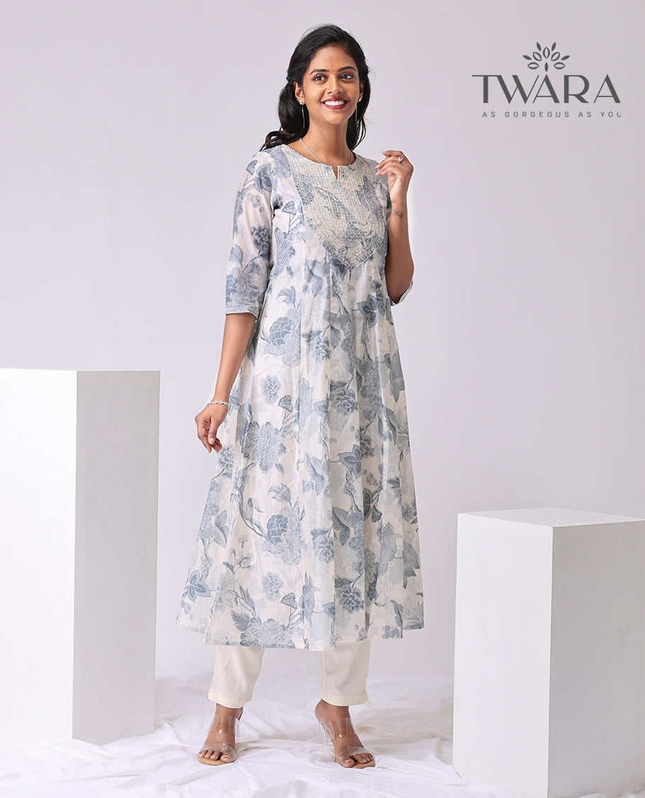 Twara cream floral print , embroidered round neck, 3/4 th sleeve , below knee lenght a-line kurti 
