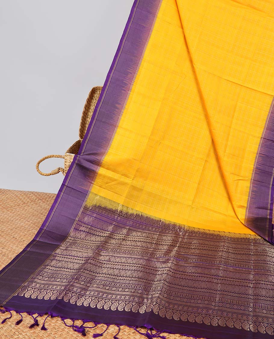 Yellow soft silk saree with contrast striped zari border & intricate zari design pallu