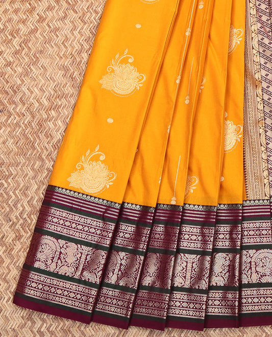 Yellow Budget Silk Saree, Subtly Enriched with Zari Buttas on Its Body, Complemented by a Contrast Traditional Zari Designs Woven Border, Grand Pallu of Buttas and Stripes, and Paired with a Contrast Blouse