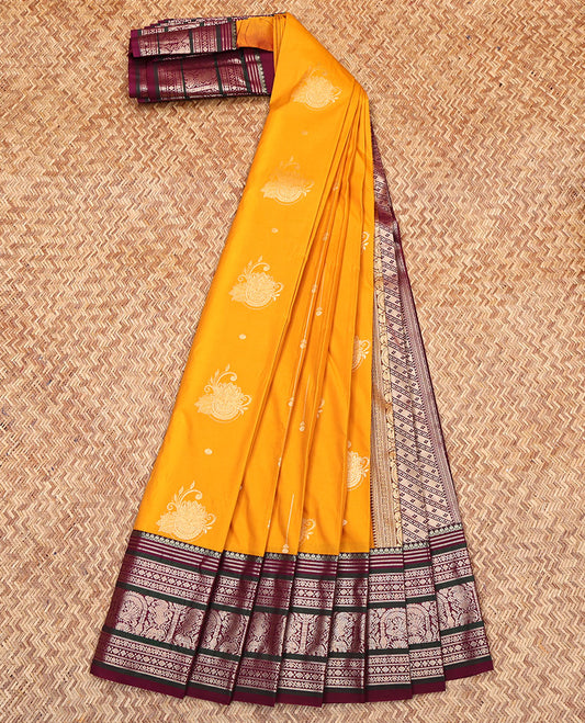 Yellow Budget Silk Saree, Subtly Enriched with Zari Buttas on Its Body, Complemented by a Contrast Traditional Zari Designs Woven Border, Grand Pallu of Buttas and Stripes, and Paired with a Contrast Blouse