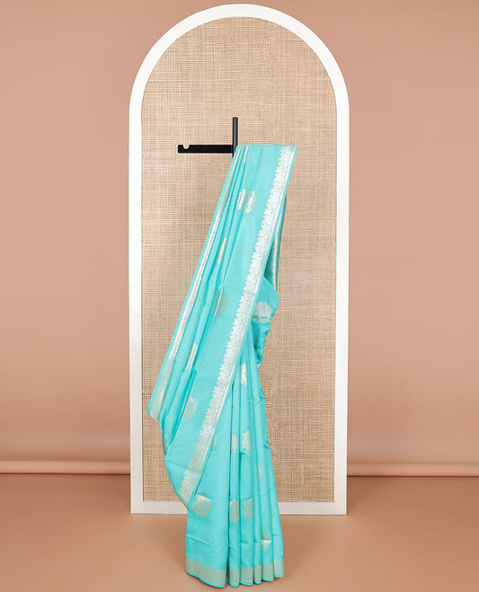 Light blue flower motifs butter silk saree with self floral design border & floral design pallu