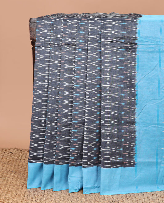 Grey Ikkat Cotton Saree Adorned with Ikkat Buttas, Complemented by a Contrast Plain Border, and Pallu of Ikkat Patterns