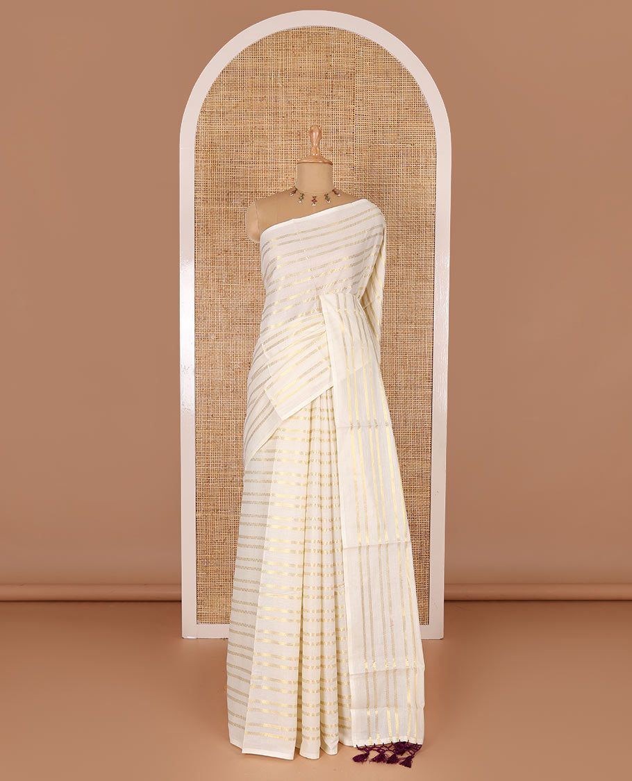Borderless cream and maroon horizontal zari muthu striped Kerala cotton saree, self-pallu with tassels and a matching blouse
