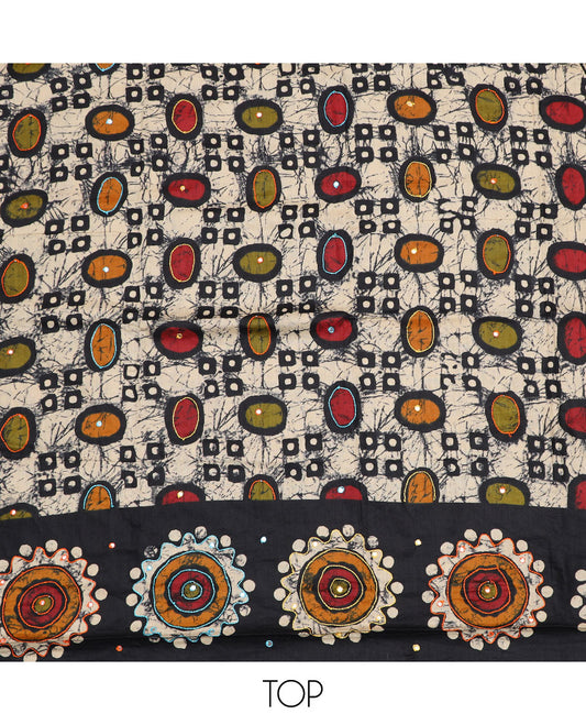 Black cotton material chudidar set, batik style geometric printed with mirror work top, contrast orange plain bottom and batik printed dupatta