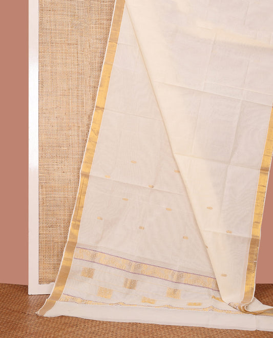 Cream Kerala Cotton Saree Dazzled with Zari Buttas All Over Its Body, Bavanji Border, Masterfully Pallu of Peacock Designs, and Paired with a Matching Blouse