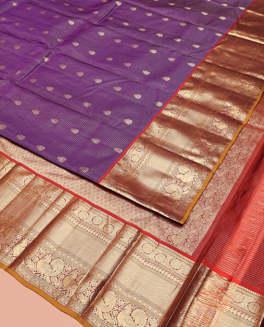 Purple Vasundhara Silk Saree Enriched with Zari Checks and Buttas, Complemented by a Contrast Border of Thilakam Mokku, Kathir, Dhavana Kodi, Manga, Mayil Kann, Laddu Kamalam, and Mayil, Pallu Decked Up with Jaal Designs, and Paired with a Contrast Blouse