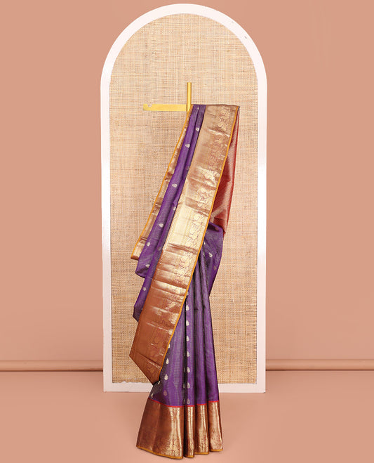 Purple Vasundhara Silk Saree Enriched with Zari Checks and Buttas, Complemented by a Contrast Border of Thilakam Mokku, Kathir, Dhavana Kodi, Manga, Mayil Kann, Laddu Kamalam, and Mayil, Pallu Decked Up with Jaal Designs, and Paired with a Contrast Blouse