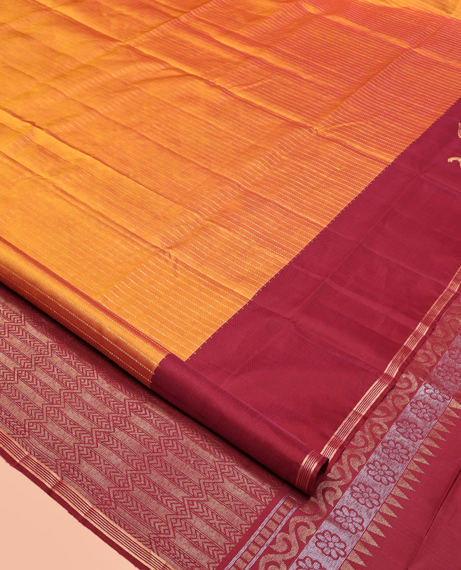 Orange Mayuri Lite Silk Mix Saree, Beautified with Muthu Stripes All Over Its Body, Complemented by a Contrast Border of Yaanai Designs, Pallu of Intricate Designs, and Paired with a Contrast Blouse