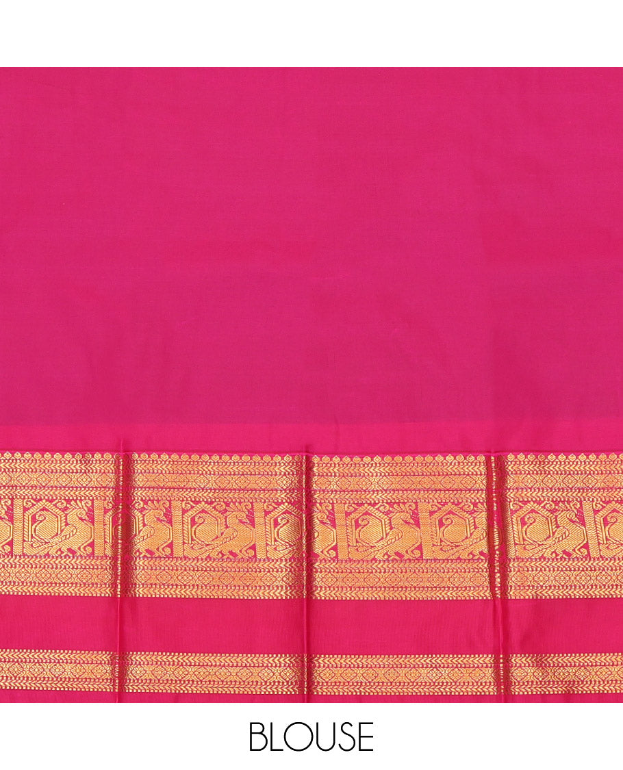 Green Budget Silk Saree, Highlighted with Peacock-Chakra Buttas, a Contrast Traditional Zari Rettai Pettu Border, a Grand Pallu and a Contrast Blouse