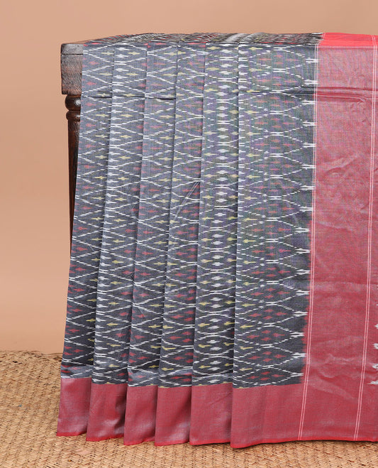 Grey Ikkat Cotton Saree Subtly Sparkled with Ikkat Buttas, Complemented by a Contrast Plain Border, and Pallu of Ikkat Patterns