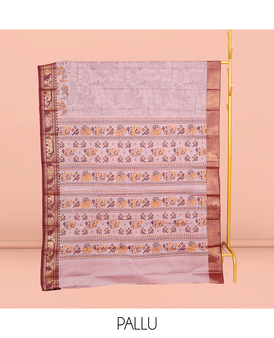 Light Pink Andhra Cotton Saree, Gleamed Up with Village-Themed Print, a Contrast Zari Elephant-Peacock Border, a Pallu of Patola-Print, and a Matching Blouse