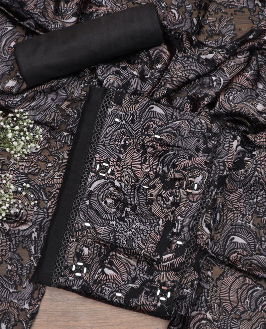 Black material chudidar set, abstract printed with mirror work embroidered top, plain bottom and abstract printed dupatta