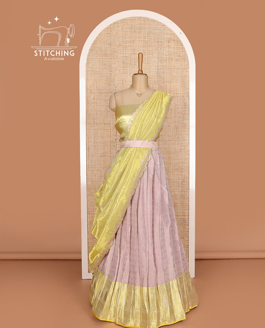 Pink art silk half-saree, sparsely design with contrast traditional motifs bordered skirt, contrast blouse, and scallop embroidered dhavani