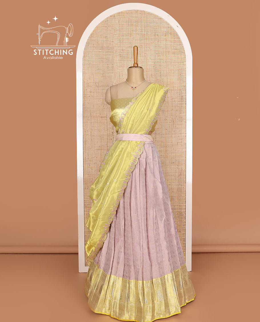 Pink art silk half-saree, sparsely design with contrast traditional motifs bordered skirt, contrast blouse, and scallop embroidered dhavani