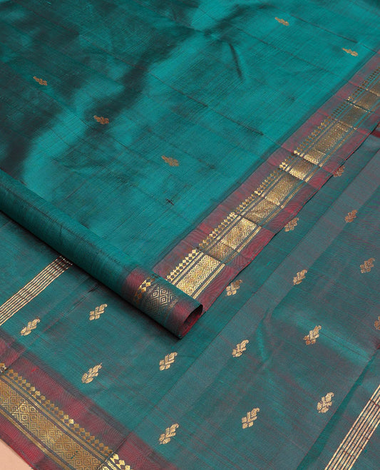 Blue zari buttas Kanchipuram silksaree, contrast one-sided border of panner sombu,banaras & mayil kann & zari design pallu