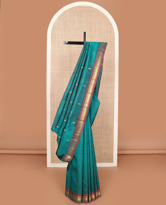 Blue zari buttas Kanchipuram silksaree, contrast one-sided border of panner sombu,banaras & mayil kann & zari design pallu