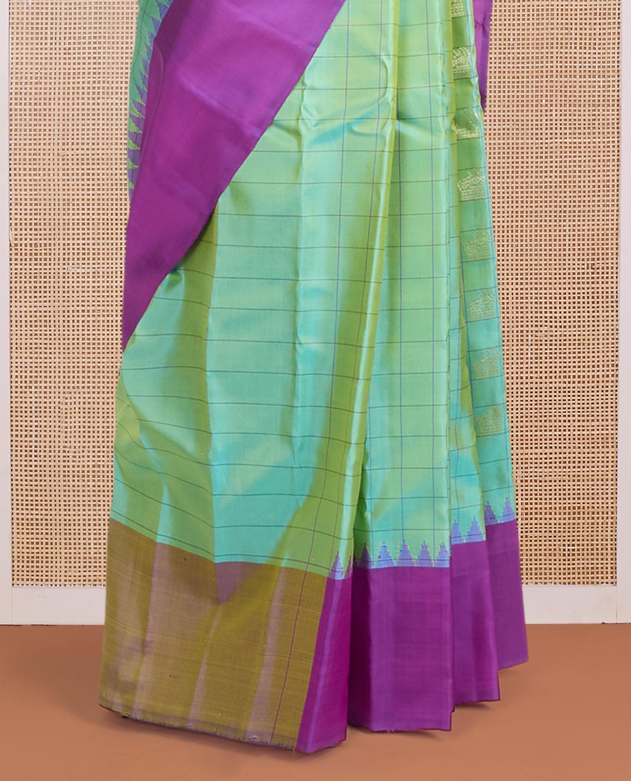 Green butta enclosed checked gadwal silk saree, contrast temple plain border & pallu steeped with horse & peacock buttas