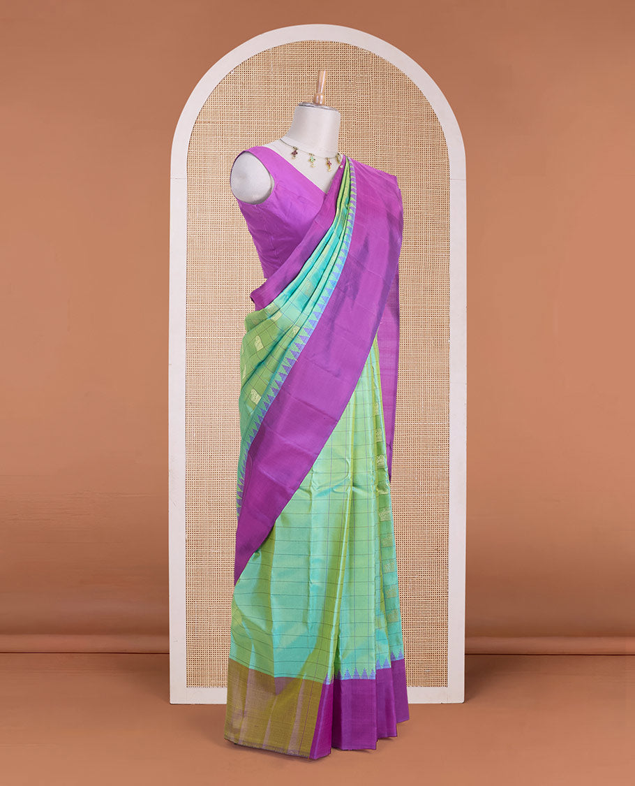 Green butta enclosed checked gadwal silk saree, contrast temple plain border & pallu steeped with horse & peacock buttas