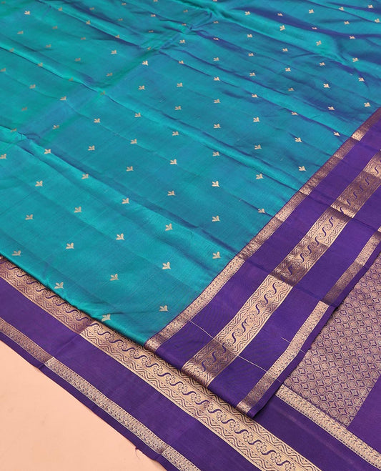 Blue Vasundhara Lite Silk Mix Saree, Showcasing Zari Buttas All Over Its Body, Complemented by Contrast Varisai Pettu Border of Kathir, Muthu, and Floral Designs, Jaal Pallu, and Paired with a Contrast Blouse