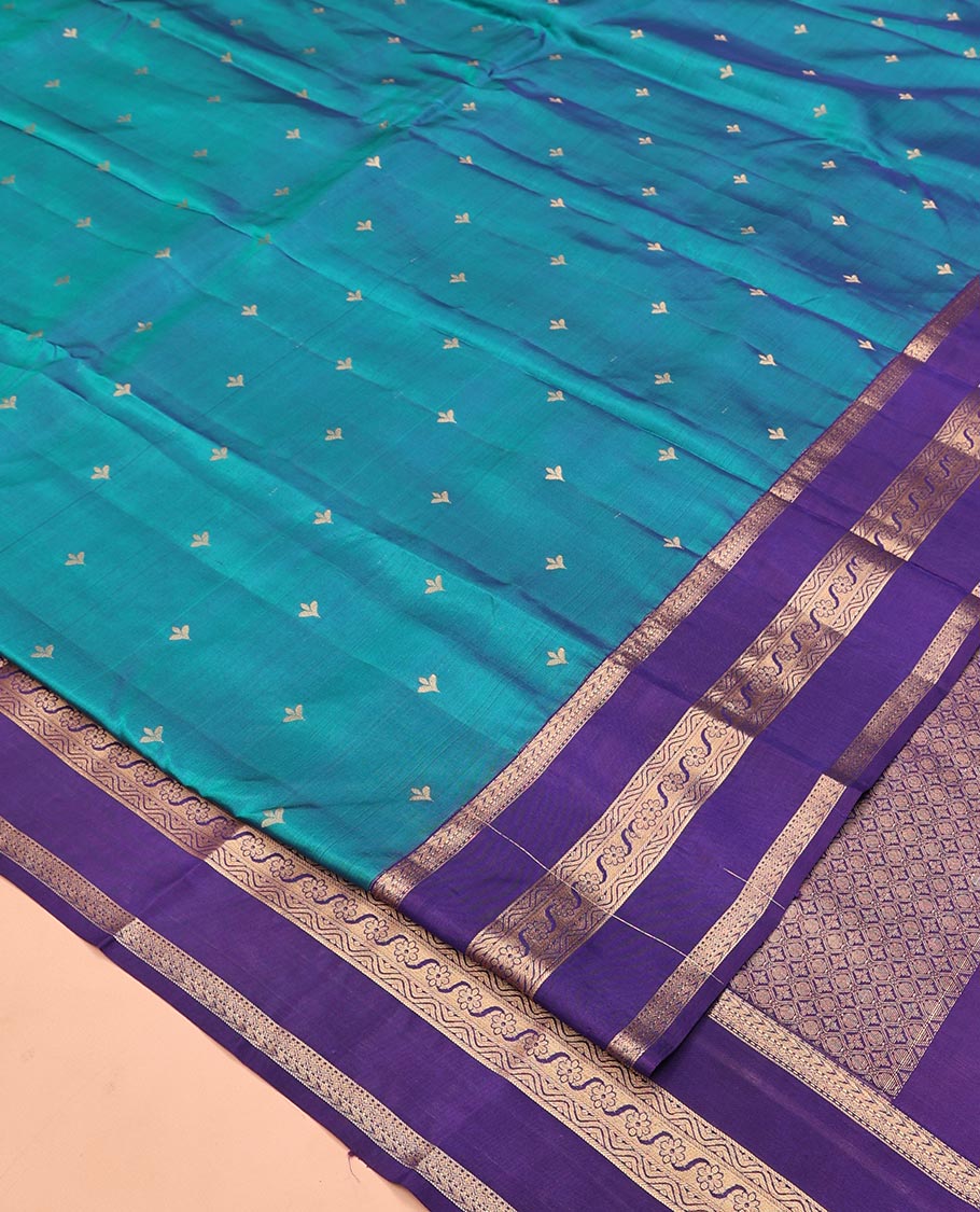 Blue Vasundhara Lite Silk Mix Saree, Showcasing Zari Buttas All Over Its Body, Complemented by Contrast Varisai Pettu Border of Kathir, Muthu, and Floral Designs, Jaal Pallu, and Paired with a Contrast Blouse