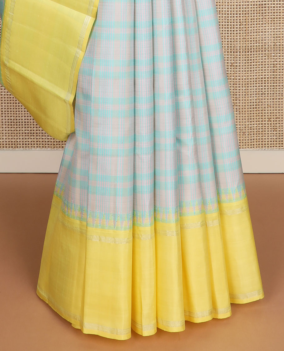 Pastel green thread checked silk saree, contrast yellow rettai pettu zari pillaiyar mokku border & zari weave pallu