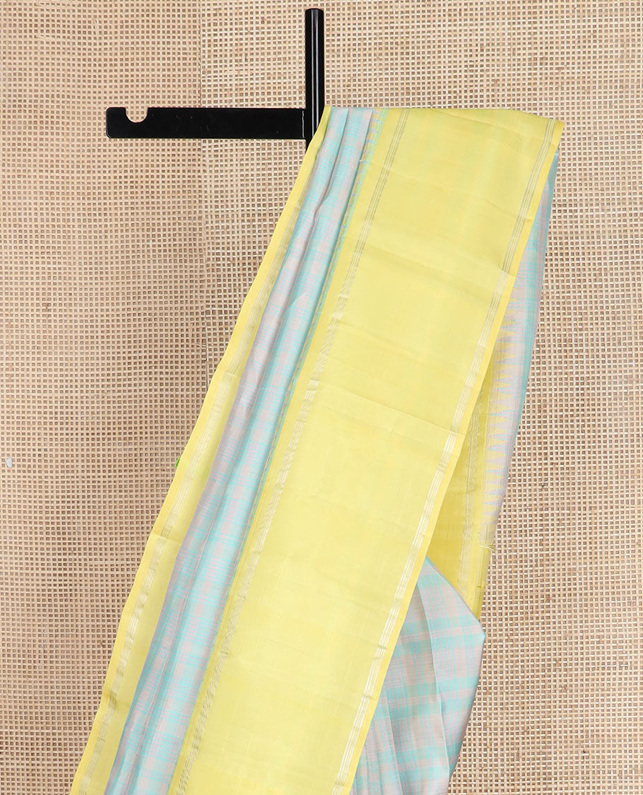Pastel green thread checked silk saree, contrast yellow rettai pettu zari pillaiyar mokku border & zari weave pallu