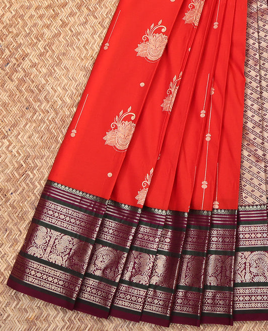 Red Budget Silk Saree, Prettified with Zari Buttas on Its Body, Complemented by a Contrast Traditional Zari Designs Woven Border, Grand Pallu of Buttas and Stripes, and Paired with a Contrast Blouse