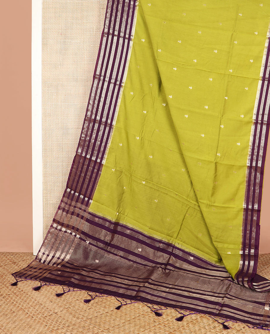Leaf green buttas assam silk saree, contrast traditional zari border, and pallu of zari design