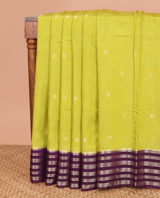 Leaf green buttas assam silk saree, contrast traditional zari border, and pallu of zari design