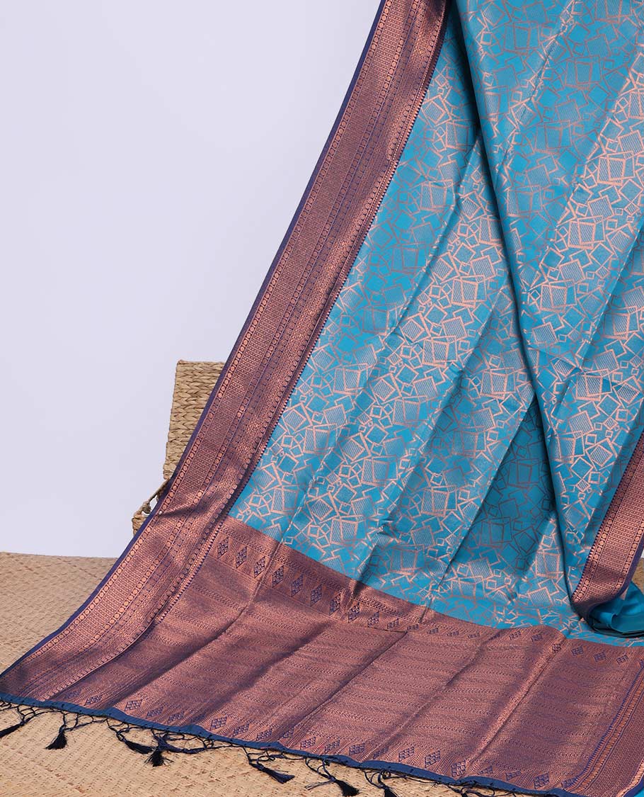 Peach geometric design butter silk saree with contrast zari border & intricate zari pallu