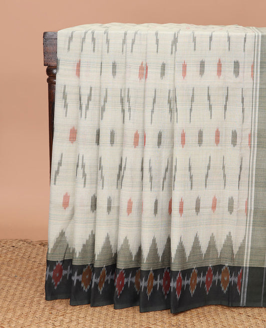 Green Ikkat Cotton Saree Adorned with Ikkat Buttas, Complemented by a Contrast Ikkat Design Border, and Pallu of Geometric Ikkat Patterns