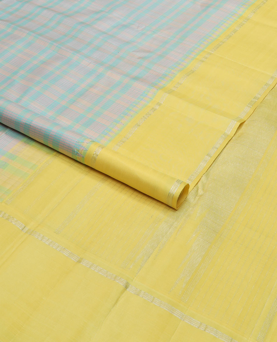 Pastel green thread checked silk saree, contrast yellow rettai pettu zari pillaiyar mokku border & zari weave pallu