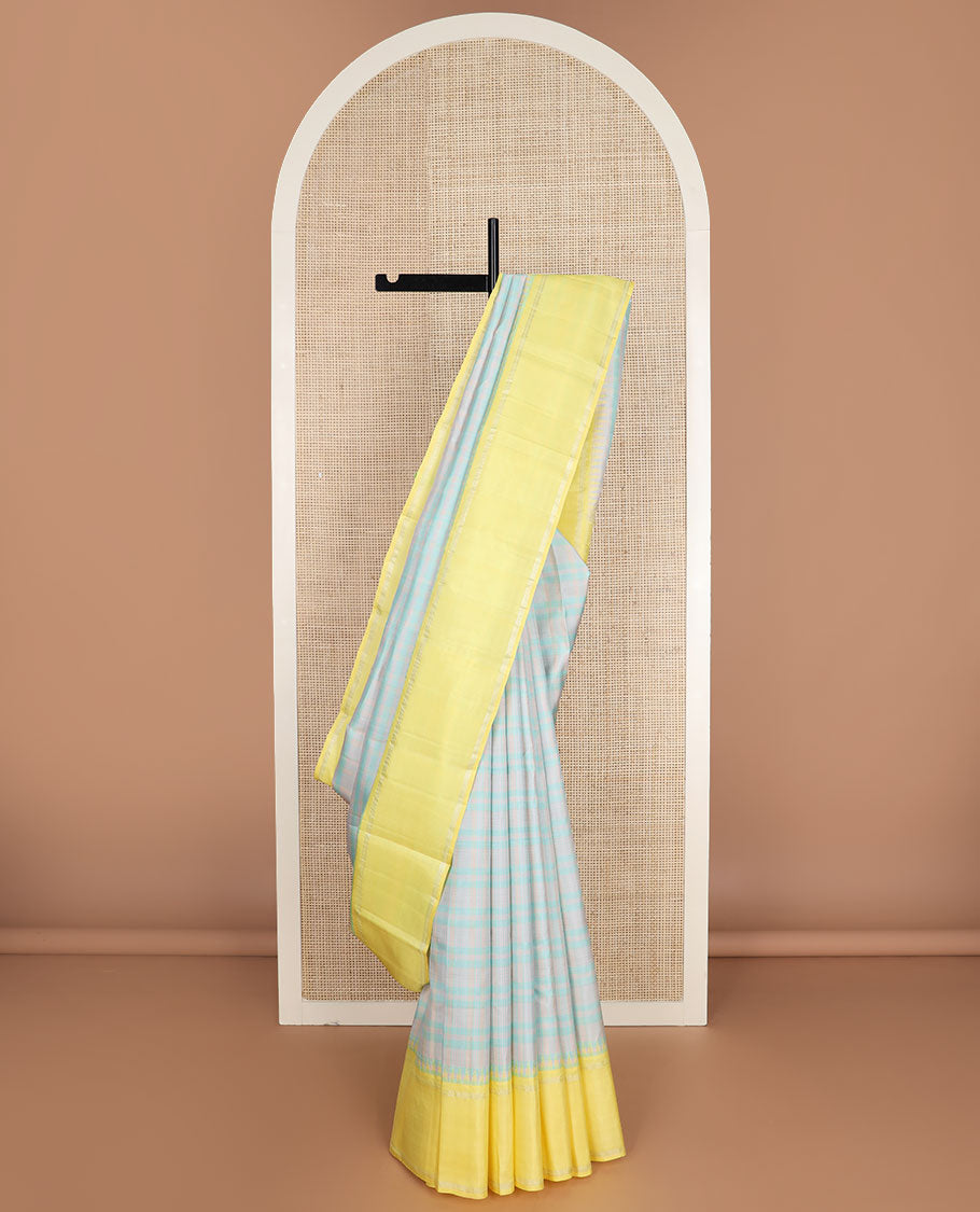 Pastel green thread checked silk saree, contrast yellow rettai pettu zari pillaiyar mokku border & zari weave pallu
