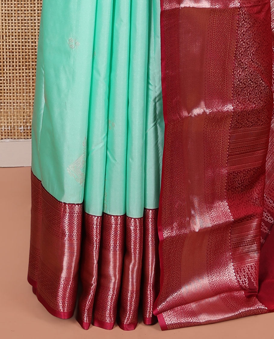 Turquoise Budget Silk Saree, Elegantly Framed with Zari Buttas on Its Body, Complemented by a Contrast Traditional Zari Design Border, Floral Design Pallu, and Paired with a Contrast Blouse