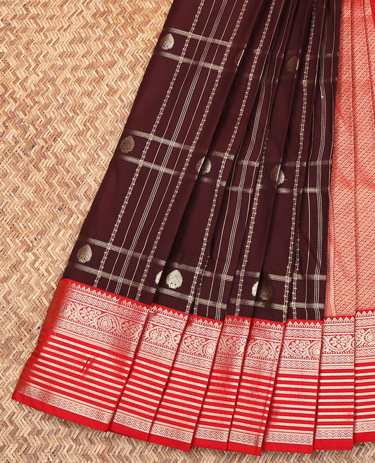 Brown Budget Silk Saree, Majestically Detailed with Zari Buttas and Checks on Its Body, Complemented by a Contrast Traditional Zari Design Border, Grand Pallu of Diagonal Stripes, and Paired with a Contrast Blouse