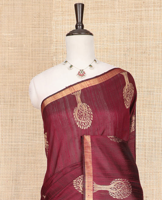 Maroon Dupion Silk Saree, Artfully Detailed with Tree Motifs All Over Its Body, Subtly Made Border, Pallu Mirrors the Same Tree Motifs, and Paired with a Matching Blouse