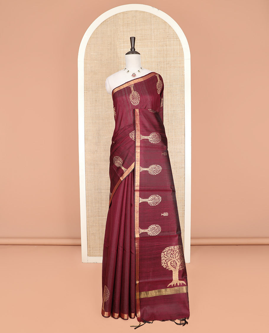 Maroon Dupion Silk Saree, Artfully Detailed with Tree Motifs All Over Its Body, Subtly Made Border, Pallu Mirrors the Same Tree Motifs, and Paired with a Matching Blouse