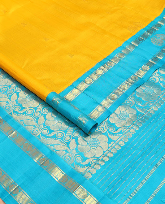 Yellow zari buttas Kanchipuram silksaree, contrast korvai one-sided rudraksham & mayil border & floral design pallu