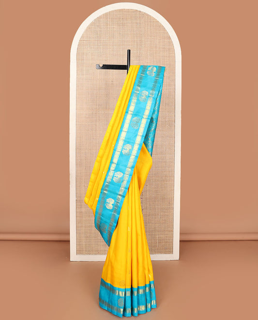 Yellow zari buttas Kanchipuram silksaree, contrast korvai one-sided rudraksham & mayil border & floral design pallu