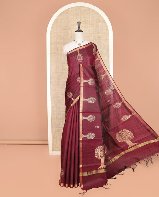Maroon Dupion Silk Saree, Artfully Detailed with Tree Motifs All Over Its Body, Subtly Made Border, Pallu Mirrors the Same Tree Motifs, and Paired with a Matching Blouse