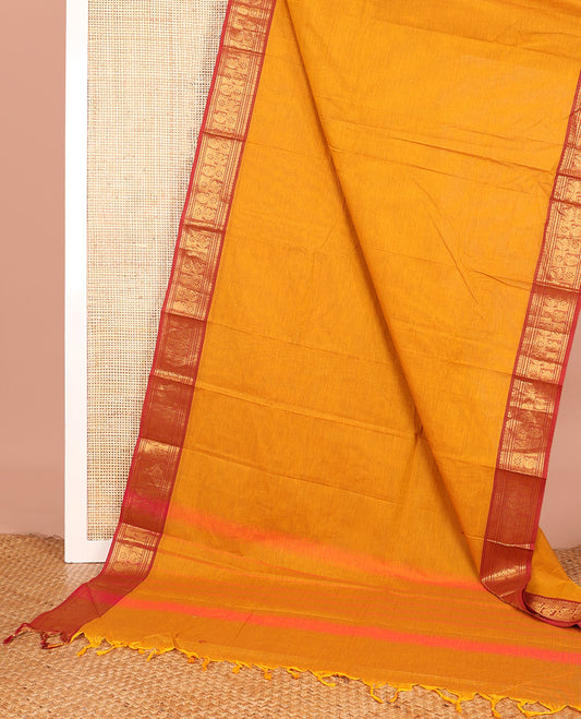 Orange Plain Chettinad Cotton Saree, Complemented by Contrast Traditional Zari Border of Peacock and Manga Designs, Subtly Woven Pallu, and Paired with a Matching Blouse