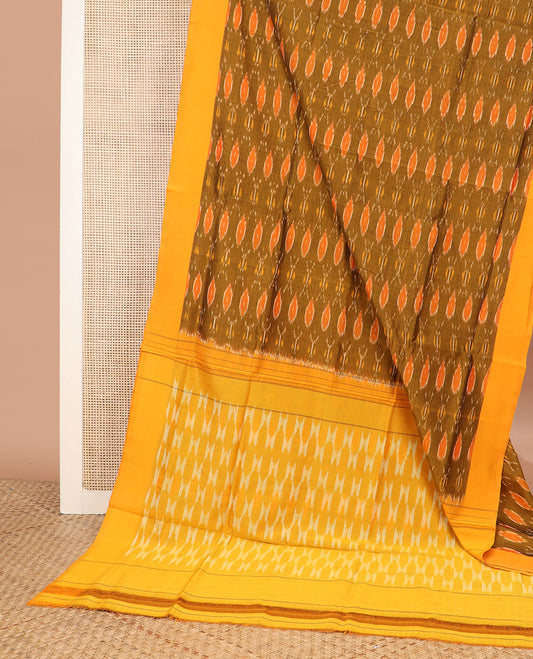 Green Ikkat Cotton Saree Bedecked with Ikkat Ogee Patterns, Complemented by a Contrast Border, and Pallu of Geometric Ikkat Patterns