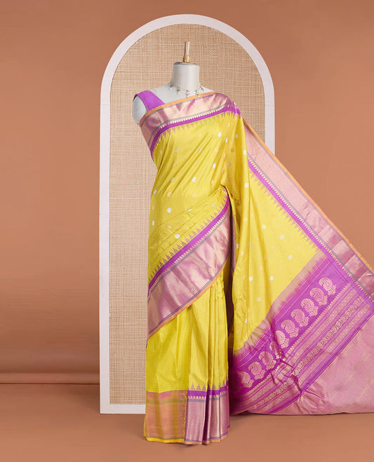 Yellow micro-checked & zari buttas gadwal silk saree, contrast temple zari border & pallu steeped with traditional designs