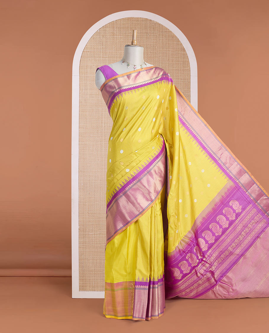 Yellow micro-checked & zari buttas gadwal silk saree, contrast temple zari border & pallu steeped with traditional designs