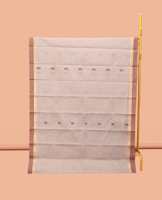 Chikku Kanchi Cotton Saree, Subtly Sparkled with Buttas, Complemented by a Contrast Border, Floral Pallu, and a Matching Blouse