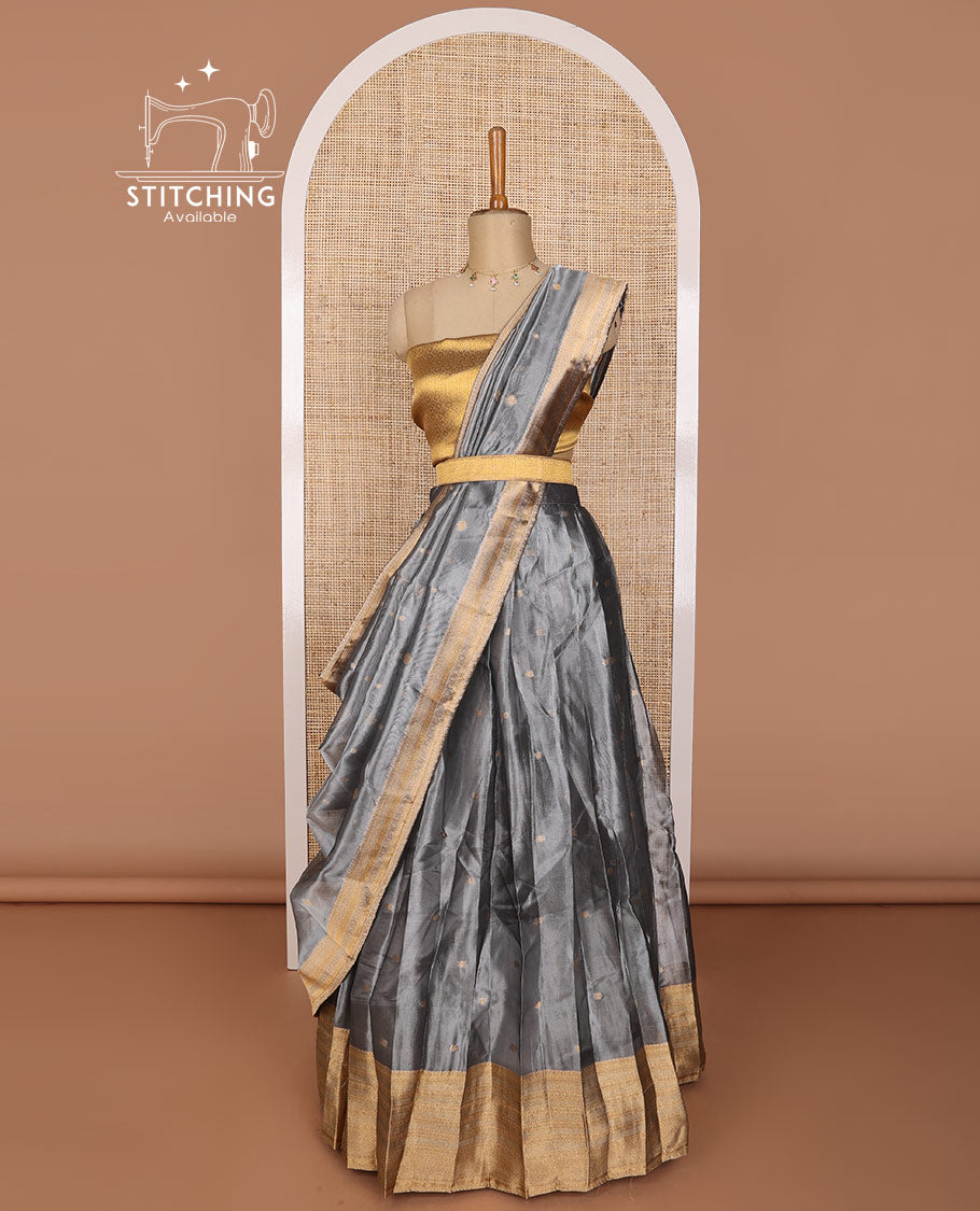 Grey buttas tissue half saree with  contrast striped border, zari design blouse & floral design dhavani