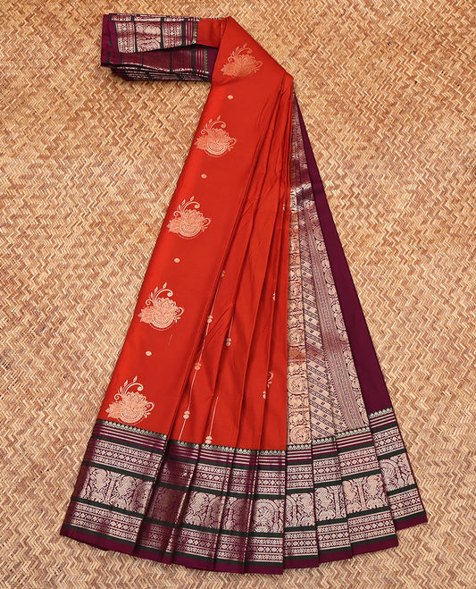 Orange Budget Silk Saree, Subtly Enriched with Zari Buttas on Its Body, Complemented by a Contrast Traditional Zari Designs Woven Border, Grand Pallu of Buttas and Stripes, and Paired with a Contrast Blouse