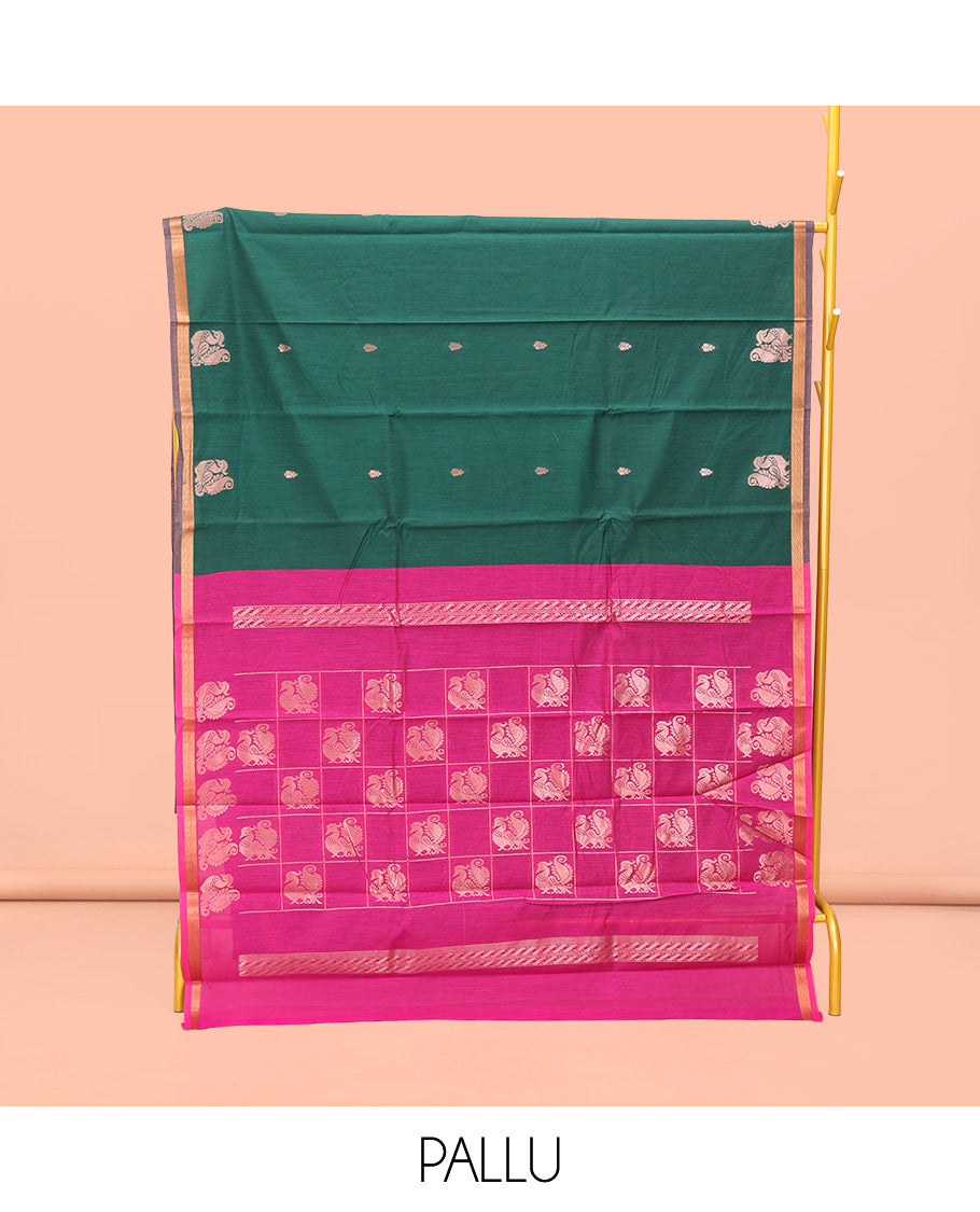 Bottle Green Semi-Silk Cotton Saree, Impeccably Designed with Peacock Zari Buttas on Its Body, Complemented by a Contrast Border of Peacock Designs, Pallu Steeped with Peacock Zari Design, and Paired with a Matching Blouse
