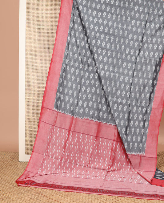 Grey Ikkat Cotton Saree Ornamented with Ikkat Buttas, Complemented by a Contrast Border, and Pallu of Geometric Ikkat Patterns